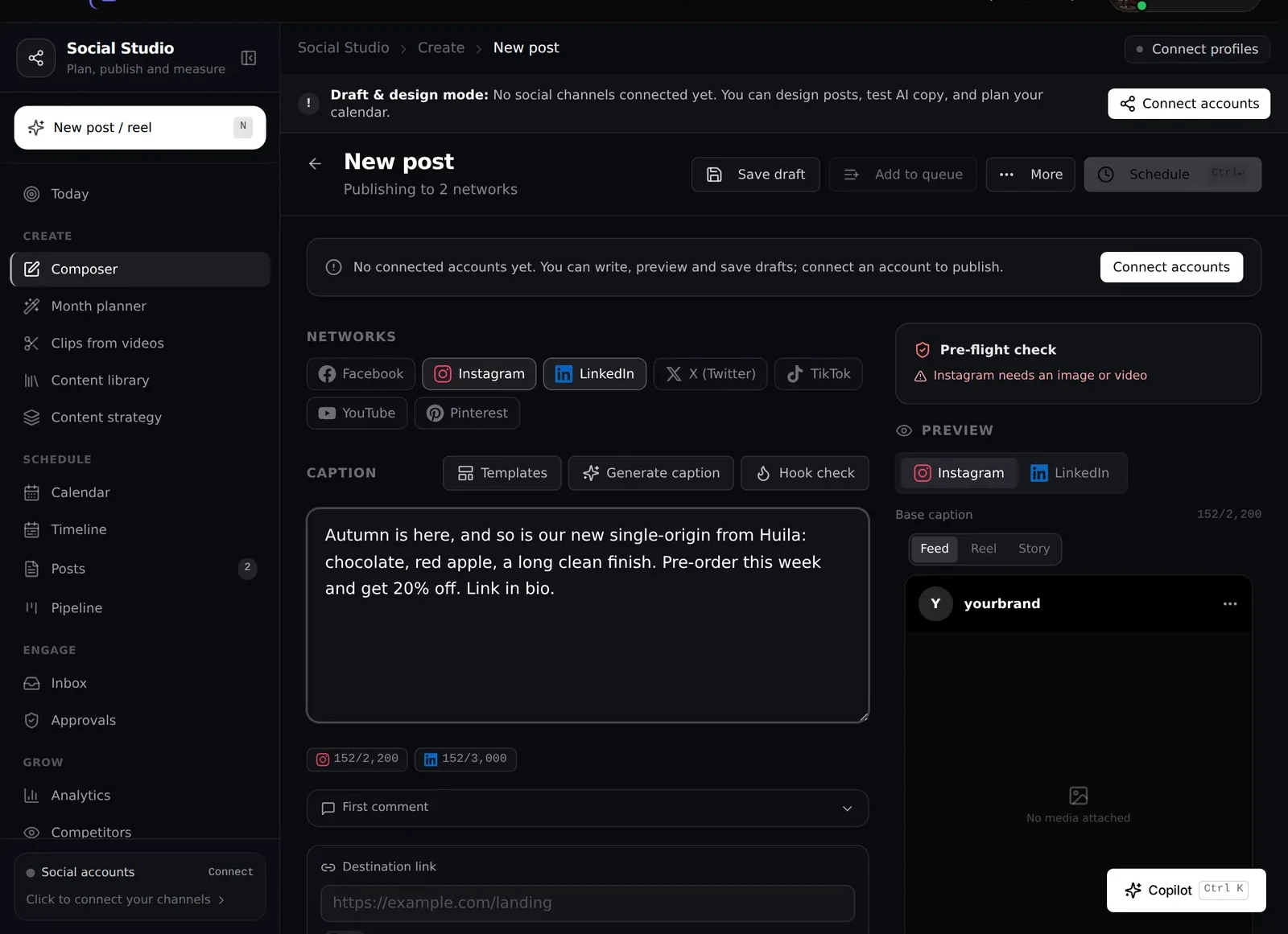 The Social Studio composer with two networks selected and a caption written