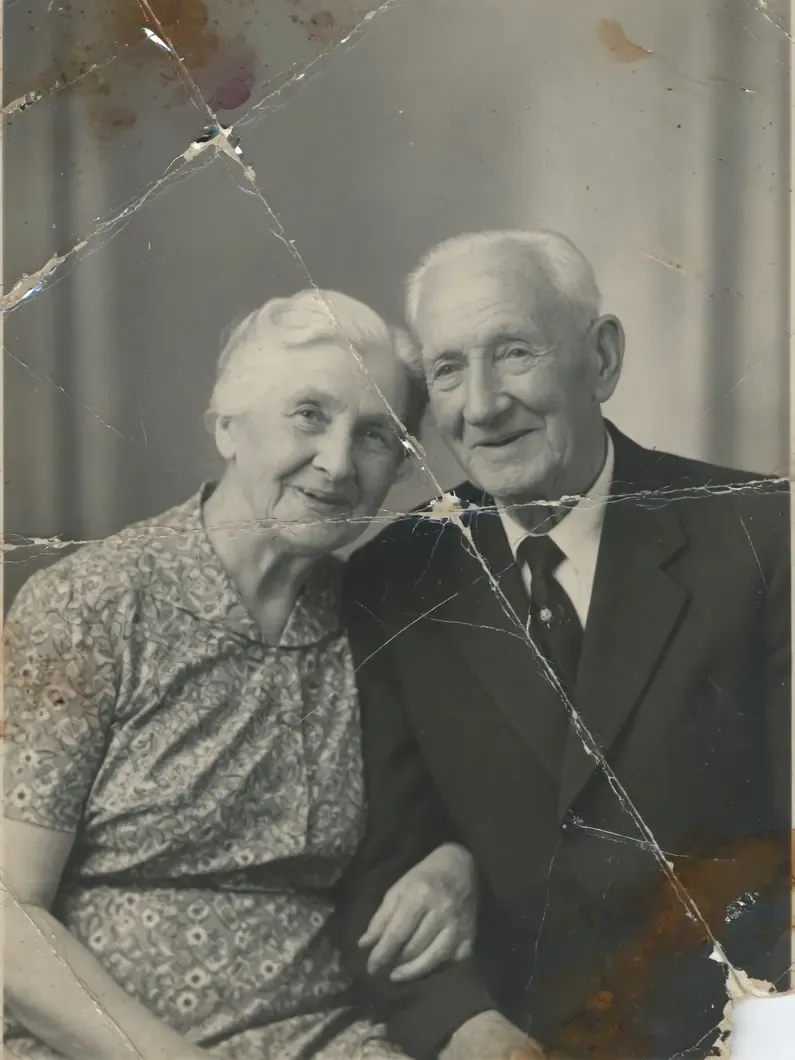 Before: a damaged black and white photo of a couple from 1960